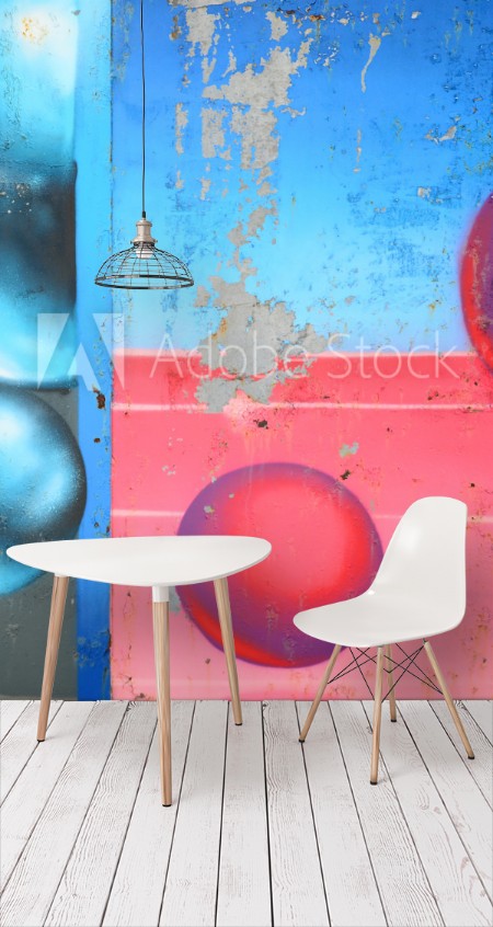 Image de Fragment of graffiti drawings The old wall decorated with paint stains in the style of street art culture Colored background texture in cold tones